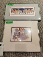 Two framed signed prints displayed on carpet. Top print shows seven Japanese figures in kimonos, 5x10 inches. Bottom print shows one Japanese figure holding a cat, 5x7 inches.