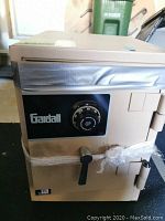 Front view of safe showing combination dial, handle and Gardall logo