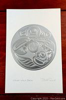 Full view of the Bill Reid art card showing the metallic embossed design on white card.