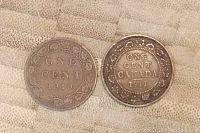 1910 and 1911 Canadian large one cent coins showing the reverse sides with denomination and year.