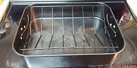 Top view of the metal roasting pan and removable wire roasting rack inside