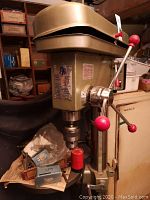 Front view of drill head showing chuck, handles and label