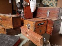 Multiple wooden boxes stacked with wooden level in front