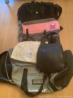 Four bags stacked together on floor showing the lot contents