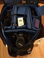 Interior view of Lowepro bag showing padded dividers and kit components