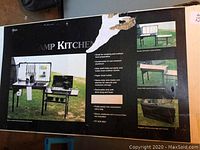 Box front showing promotional images and feature list of the camp kitchen