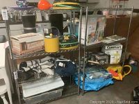 Two chrome metal wire shelving racks with various stored items (not included) shown fully assembled.