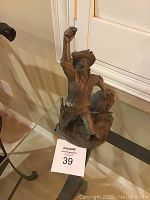 Full front angled view of the pewter prospector statue showing the raised pan and detailed base.