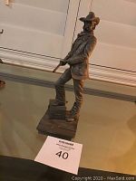 Front and side views of the pewter statue 'The Lawman'