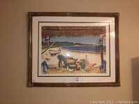 Full view of the framed John Ramos beach print hanging on wall showing the entire beach scene with picnic table and ocean background.