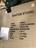 Close-up photo of the cardboard box showing Baxton Studio branding, model IDB048, colour gloss PU brown, queen bed size, headboard description, carton 1 of 2.