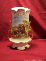 Front full view of the lamp base with hand-painted Old Kent Road horse carriage scene and gold-tone handles.