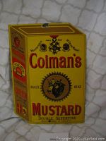 Front and side view of the rectangular vintage Colman's Mustard enamel sign, showing the design and size with visible minor surface damage.