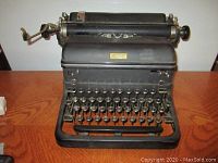 Front angle showing full keyboard and body of Royal typewriter with visible wear.