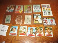 Six color Topps cards on top row and five modern cards on bottom, three antique tobacco cards in middle