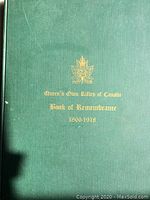 Front cover of the green hardcover book with gold embossed title and emblem.
