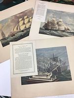 Three vintage ship prints spread out on a surface with text cards describing each ship included