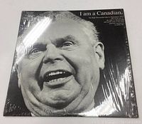 Front cover of the vinyl LP record 'I Am a Canadian' featuring a black and white close-up portrait of John G. Diefenbaker, shrink-wrapped.
