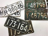 Three pairs of vintage Ontario licence plates from 1963,1964 and 1966, showing the different colors and conditions.