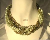 Frontal view of the vintage 19-inch multi-strand gold chain necklace with faux pearls and rhinestones on a display bust, showing twisted, heavy design.