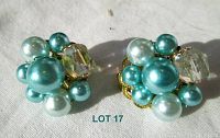 Both earrings shown, displaying cluster of faux blue and white pearls with aurora borealis faceted stone in gold-tone clip-on setting.