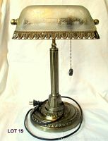 Full view of entire lamp showing base, vertical column stand, cord and plug, and frosted glass shade with etched design.
