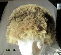 Front view of 1960s vintage fur hat showing the fluffy rounded shape and natural fur colors.