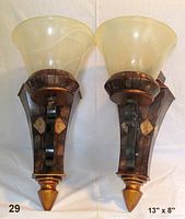 Pair of large, heavy wall sconces with frosted glass shades and metal bases with marble inlays shown front view