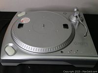 Silver Ion TTUSB turntable with tonearm, platter, and control buttons.