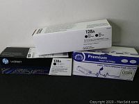 Three boxes of ink cartridges: two HP 128A boxes and one premium CE320A box shown side by side.