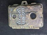 Front view of the SpyPoint HD-7 trail camera showing the camouflage casing, lens, infrared LEDs and sensor array.