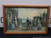 Front view of framed art print showing a historical scene with people in 18th or 19th century attire, gathered outside, with a carriage in background.