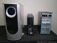 Photo of three different desktop computer towers, showing various front panels and designs.