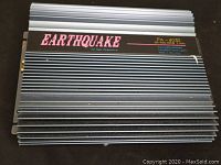 Top view of Earthquake PA-4030 amplifier showing overall condition and aluminum heat-sink design with branding.