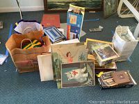 Overview of multiple books, puzzles, some in bags, and boxed puzzles on floor.