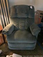 Front view of green La-Z-Boy recliner chair showing padded backrest and armrests.