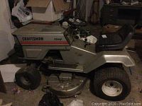 Full side profile of the Craftsman riding lawnmower showing overall condition and size.