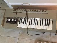Magnus Electric Chord Organ showing keyboard and chord buttons