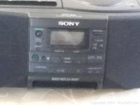 Close-up of the central control panel showing the cassette player, buttons, and display with SONY logo and BASS REFLEX BODY label.