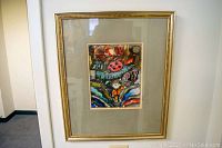 Frontal view of framed watercolor painting showing colorful artistic depiction of boy and ladybug with mat and frame details.