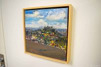 Framed oil painting showing Los Angeles cityscape with sky and hillside