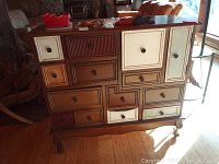 Full front view of cabinet showing drawer layout and mixed finish