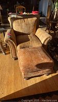 Arm chair and ottoman in sunlight, front view
