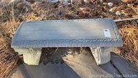 Top view of the concrete bench showing scroll detail around edges.