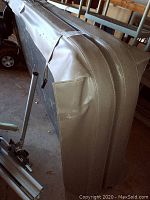 Side and corner of hot tub cover showing vinyl material and thickness.