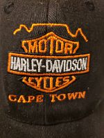 Close-up of the front embroidered logo showing Harley-Davidson shield and "Cape Town" text