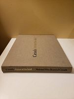 Beige hardcover book lying flat showing spine and cover text 'Canada A year of the land' by National Film Board of Canada