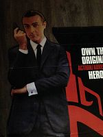 Full length view of the cardboard standee showing Sean Connery in black suit holding a gun, with 007 red text in background