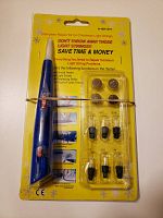 Front view of Lee Valley Christmas Light Tester kit in original sealed blister packaging showing circuit tester, replacement bulbs, and fuse testers on yellow backing.