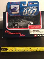 Front view of the diecast car in original packaging shows the detailed silver Aston Martin model and packaging design with James Bond 007 and Die Another Day branding.